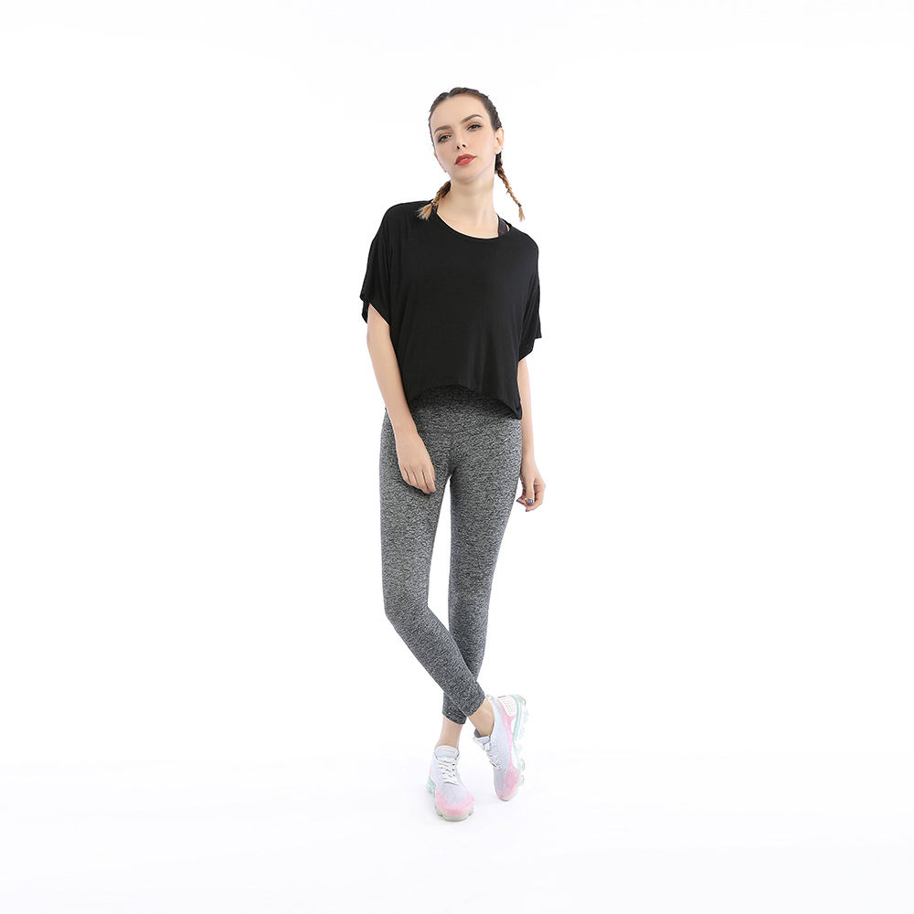 Custom activewear set with performance top and high-waist leggings manufactured by RIVON SPORTS